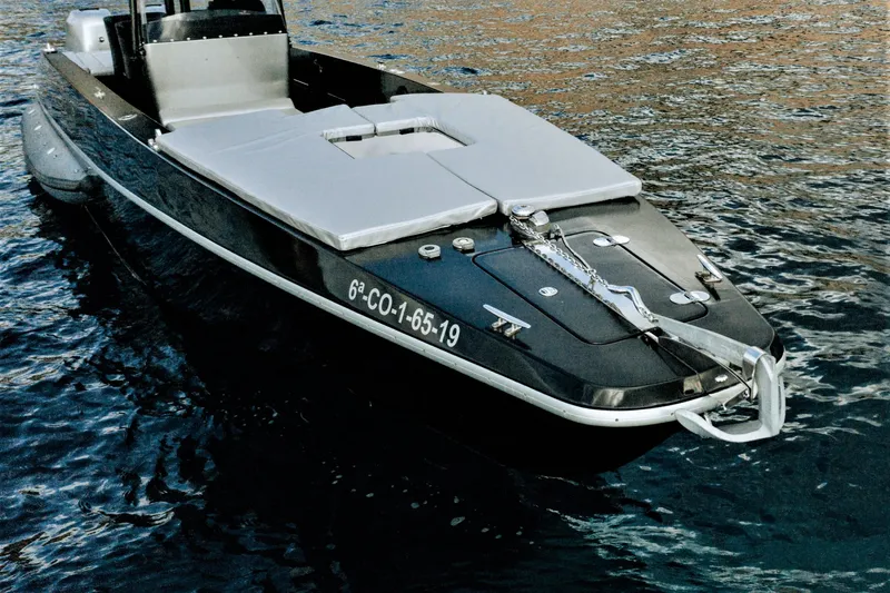 F11 Yacht Photos Pics FB Design Fabio Buzzi FB 38/19 S 2008 speedboat on water, sleek black exterior.