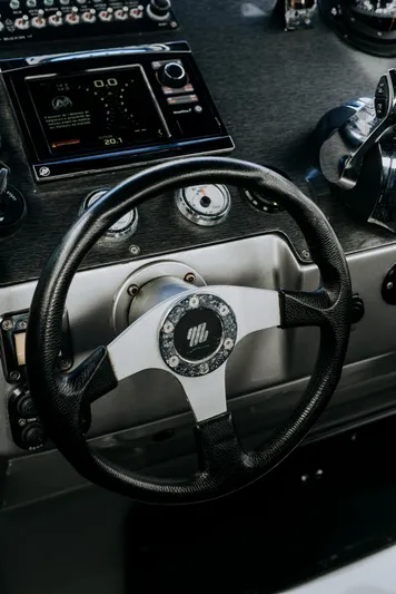 F11 Yacht Photos Pics Steering wheel of 2008 FB Design Fabio Buzzi FB 38/19 S boat cockpit.