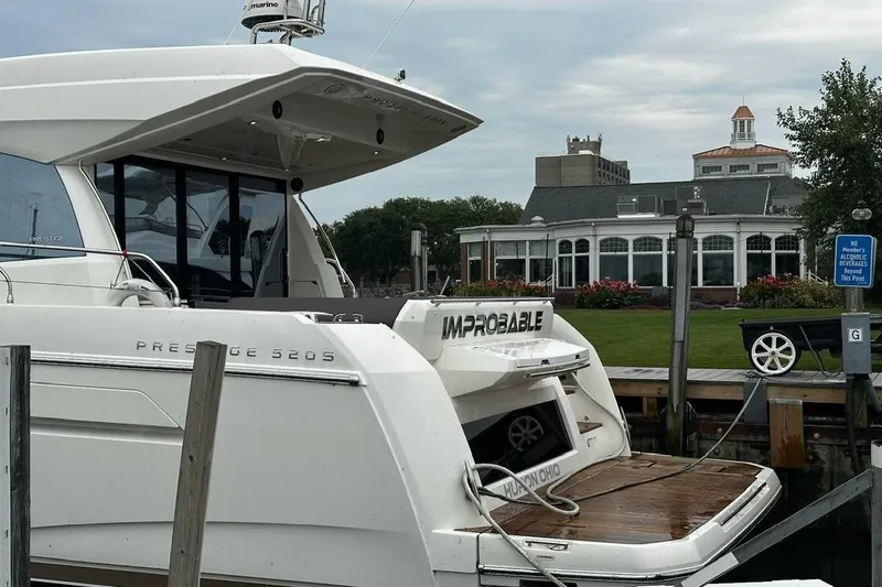Improbable Yacht Photos Pics Luxury 2019 Prestige 520 yacht docked near elegant waterfront building.