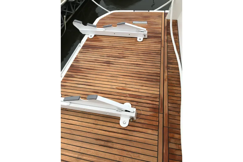 Improbable Yacht Photos Pics Teak deck of 2019 Prestige 520 yacht with metal fittings.