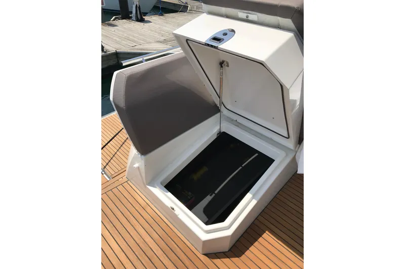 Improbable Yacht Photos Pics Open storage compartment on 2019 Prestige 520 yacht, featuring teak decking.