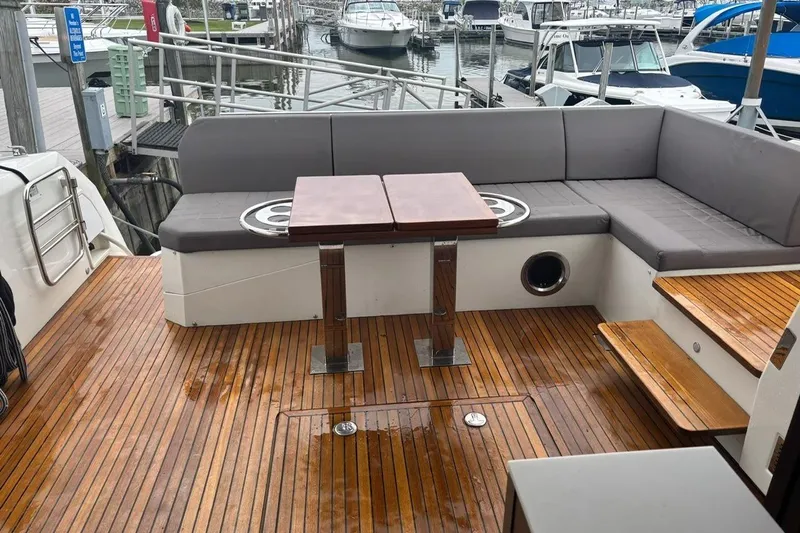 Improbable Yacht Photos Pics Luxurious 2019 Prestige 520 yacht deck with wooden flooring and comfortable seating.