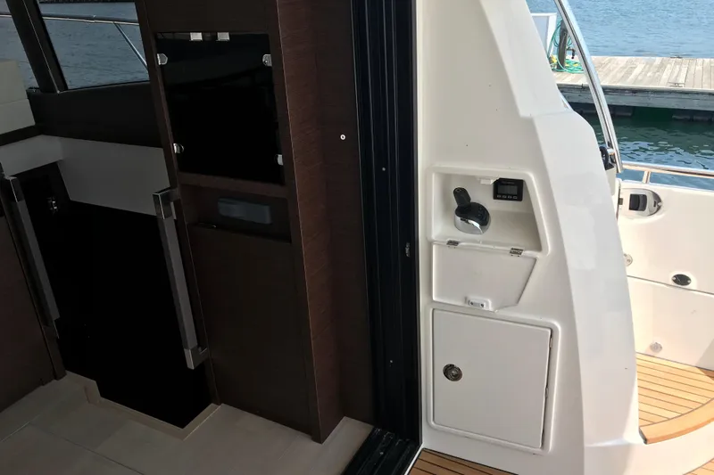 Improbable Yacht Photos Pics Interior view of a 2019 Prestige 520 yacht, featuring sleek wood and modern design elements.