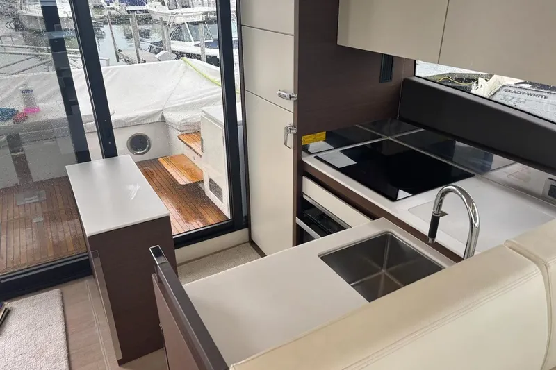 Improbable Yacht Photos Pics Modern kitchen interior on 2019 Prestige 520 yacht with sleek design and marina view.