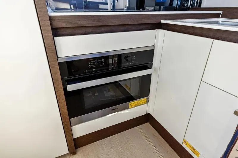 Improbable Yacht Photos Pics Modern kitchen with built-in Miele oven on a 2019 Prestige 520 yacht.