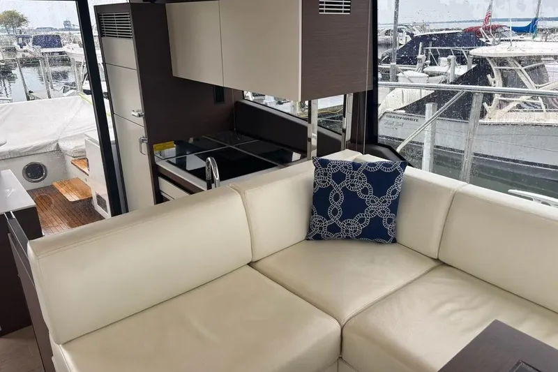 Improbable Yacht Photos Pics Luxurious interior of 2019 Prestige 520 yacht with white leather seating and modern kitchen.