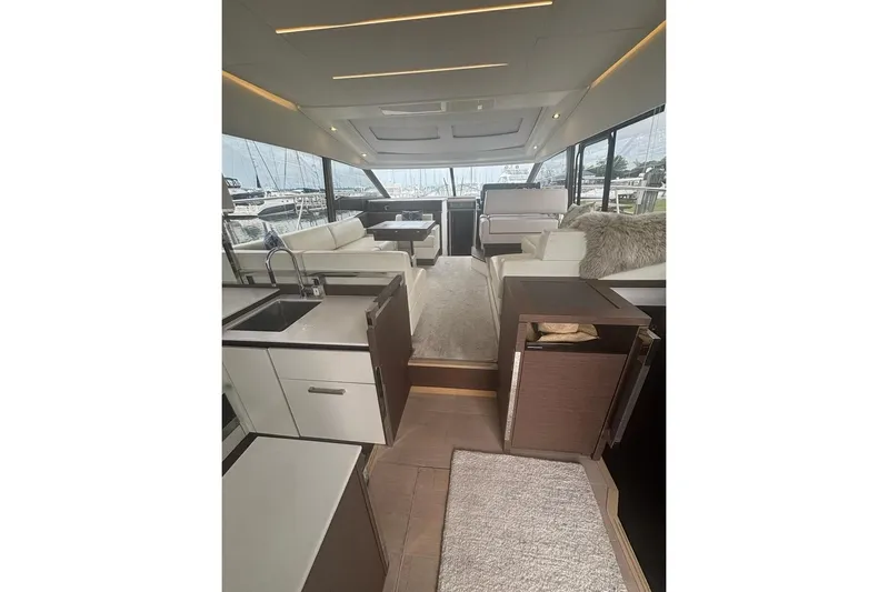 Improbable Yacht Photos Pics Luxurious interior of a 2019 Prestige 520 yacht with modern furnishings and panoramic windows.