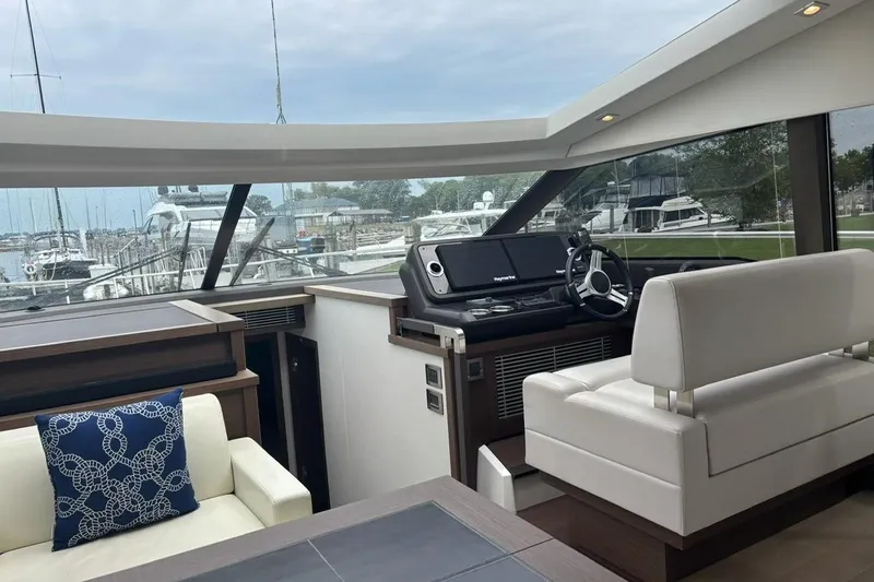 Improbable Yacht Photos Pics Interior of 2019 Prestige 520 yacht with modern helm and seating area.