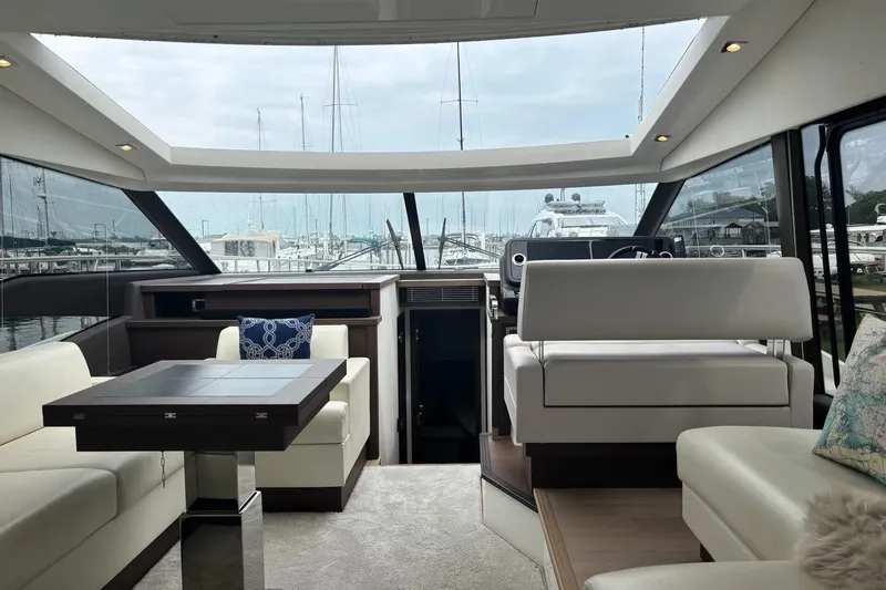 Improbable Yacht Photos Pics Luxurious interior of a 2019 Prestige 520 yacht with elegant seating and panoramic windows.