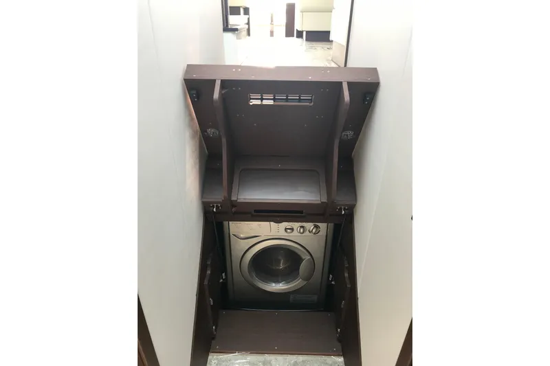 Improbable Yacht Photos Pics Compact laundry area with a washing machine in a 2019 Prestige 520 yacht.