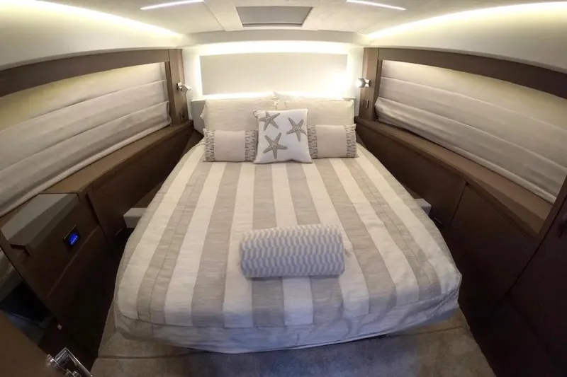 Improbable Yacht Photos Pics Luxurious bedroom interior of 2019 Prestige 520 yacht with striped bedding and starfish pillows.