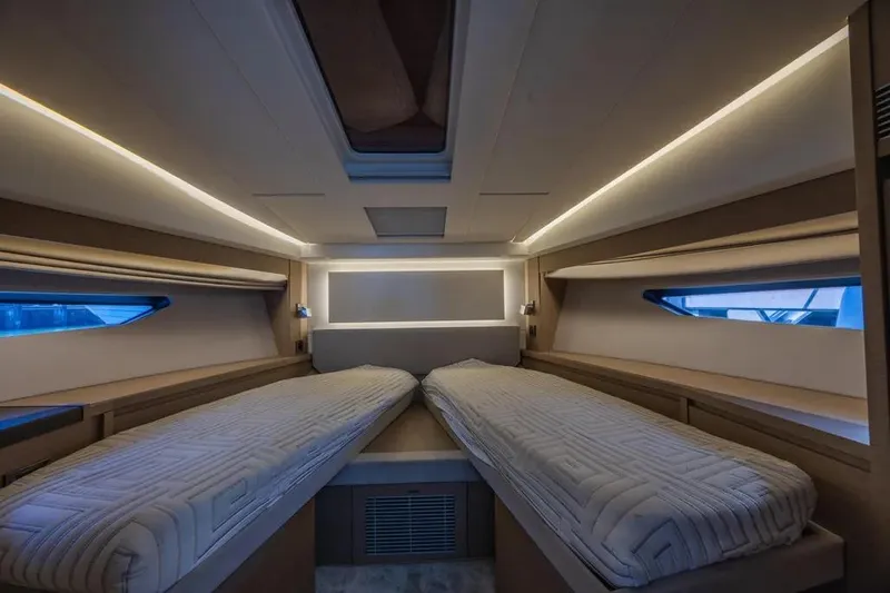 Improbable Yacht Photos Pics Luxurious interior cabin of a 2019 Prestige 520 yacht with twin beds and ambient lighting.