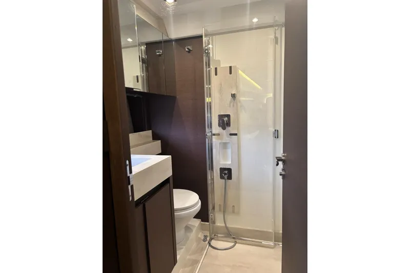 Improbable Yacht Photos Pics Modern bathroom in 2019 Prestige 520 yacht with glass shower and sleek fixtures.