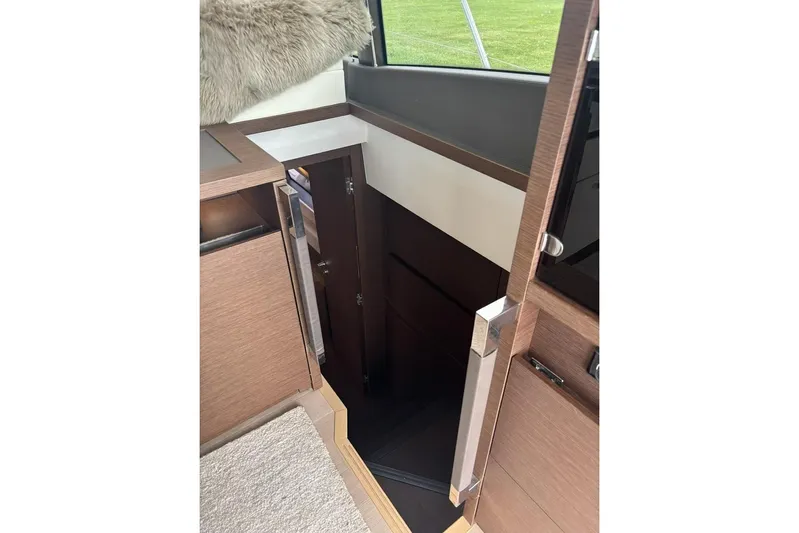 Improbable Yacht Photos Pics Interior of 2019 Prestige 520 yacht showing stairs and modern wood finish.