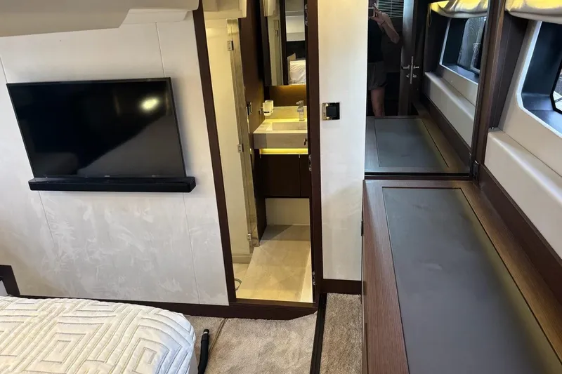 Improbable Yacht Photos Pics Luxurious interior of a 2019 Prestige 520 yacht, featuring a TV and modern bathroom.