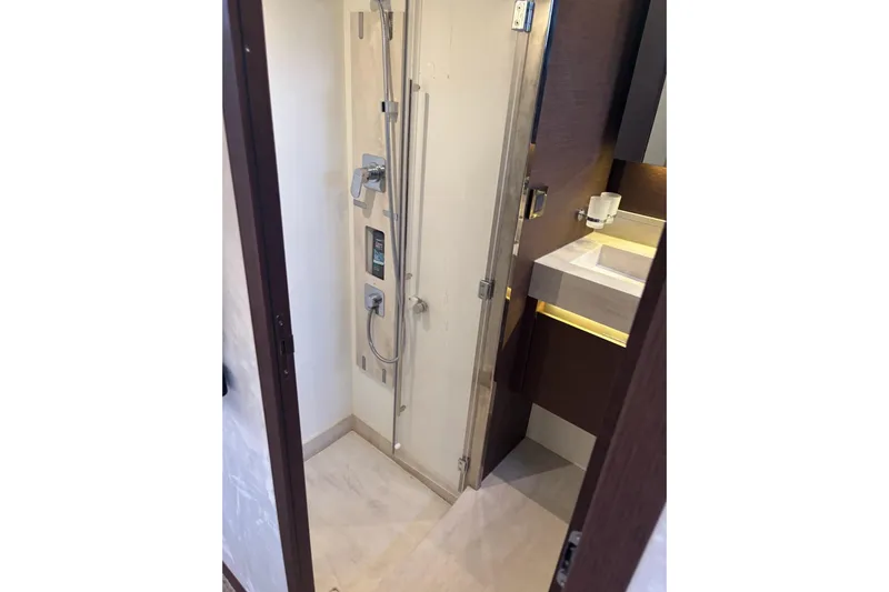 Improbable Yacht Photos Pics Luxurious bathroom in 2019 Prestige 520 yacht with modern shower and sleek sink design.