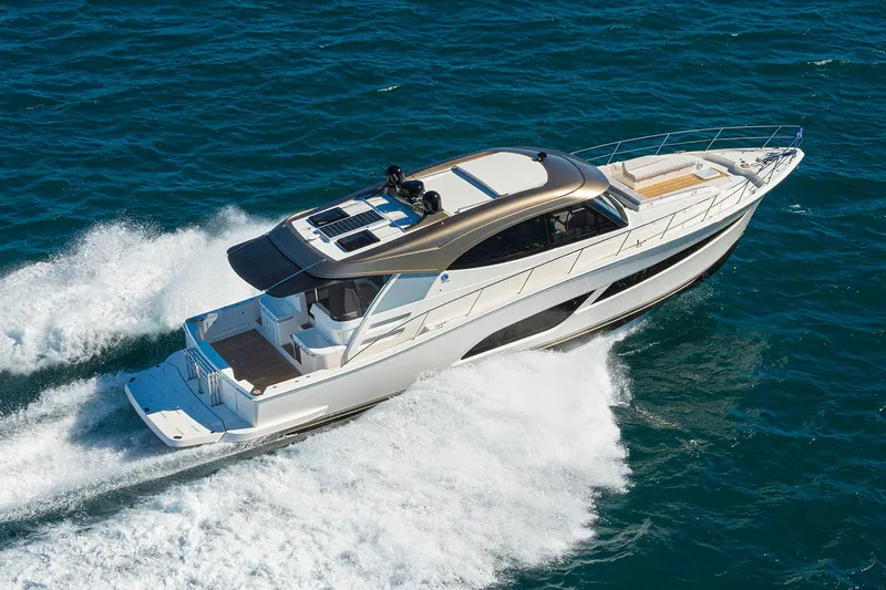  Yacht Photos Pics Manufacturer Provided Image: 2025 Riviera 585 SUV cruising on open water, showcasing sleek design and powerful performance.