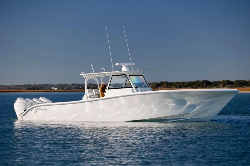  Yacht Photos Pics 2017 Yellowfin 42 Offshore boat cruising on calm water under clear sky.
