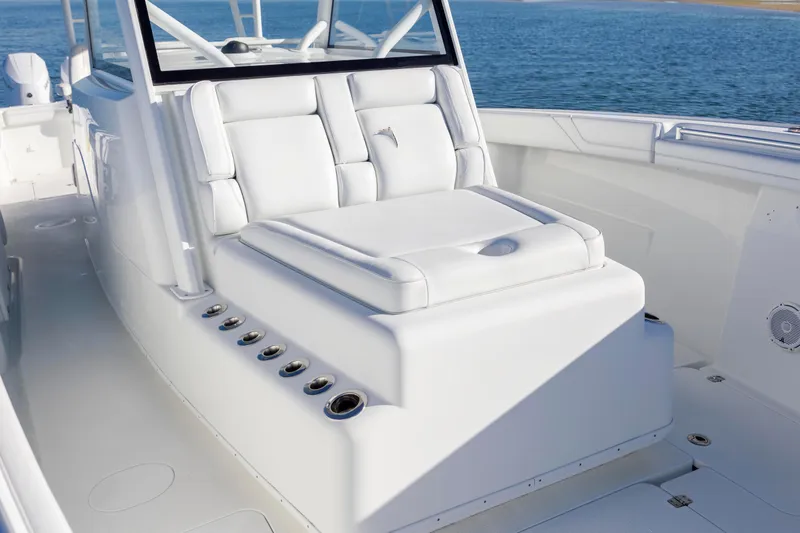  Yacht Photos Pics 2017 Yellowfin 42 Offshore boat interior with white seating and ocean backdrop.