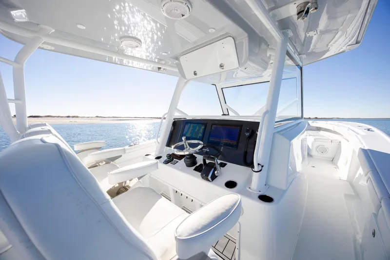  Yacht Photos Pics 2017 Yellowfin 42 Offshore boat interior with modern helm and ocean view.