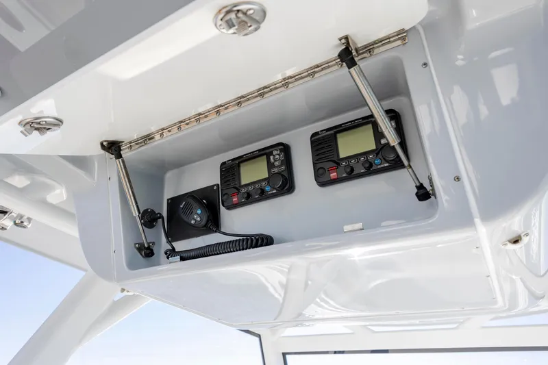  Yacht Photos Pics 2017 Yellowfin 42 Offshore boat radio equipment in overhead compartment.