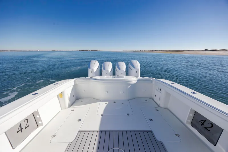  Yacht Photos Pics 2017 Yellowfin 42 Offshore boat with four engines on open water.