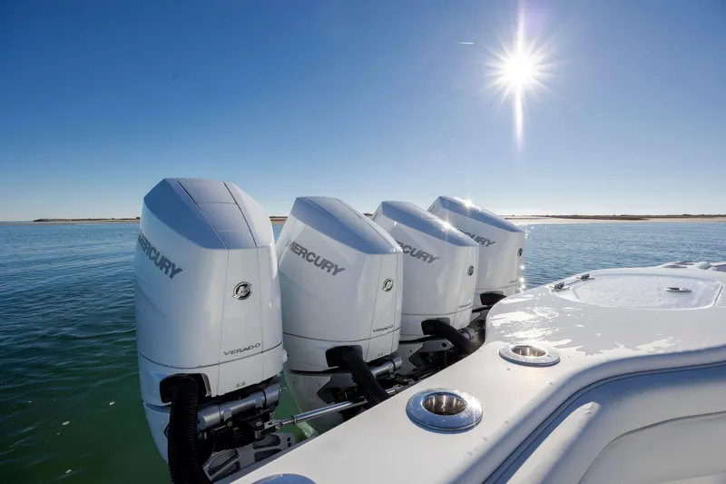  Yacht Photos Pics 2017 Yellowfin 42 Offshore boat with four Mercury Verado engines under a bright sun.