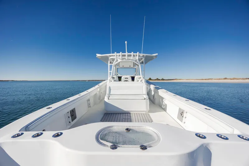  Yacht Photos Pics 2017 Yellowfin 42 Offshore boat on calm water under clear blue sky.
