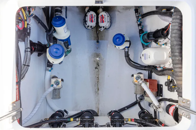  Yacht Photos Pics 2017 Yellowfin 42 Offshore boat engine compartment with pumps and wiring.
