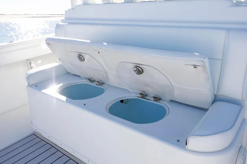  Yacht Photos Pics 2017 Yellowfin 42 Offshore boat seating with storage compartments, ocean view.
