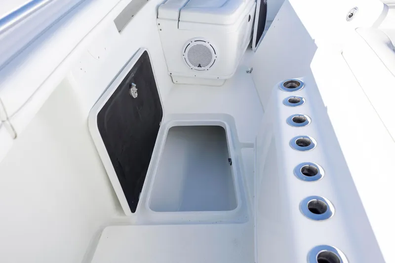  Yacht Photos Pics 2017 Yellowfin 42 Offshore boat interior with storage compartments and rod holders.