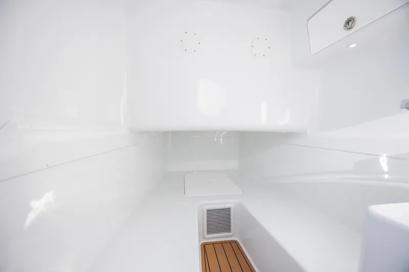  Yacht Photos Pics 2017 Yellowfin 42 Offshore interior cabin with sleek white design and wood accents.