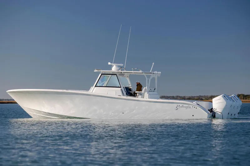 Yacht Photos Pics 2017 Yellowfin 42 Offshore boat cruising on calm water under clear sky.