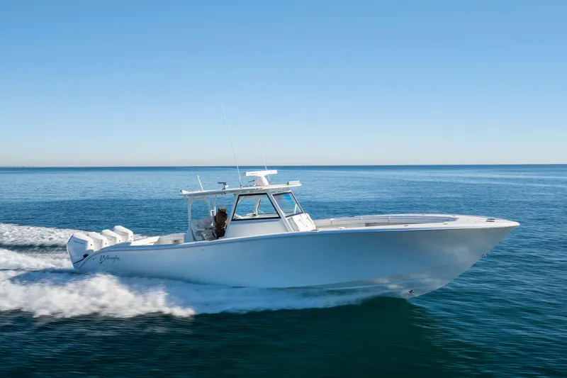  Yacht Photos Pics 2017 Yellowfin 42 Offshore boat cruising on open water.