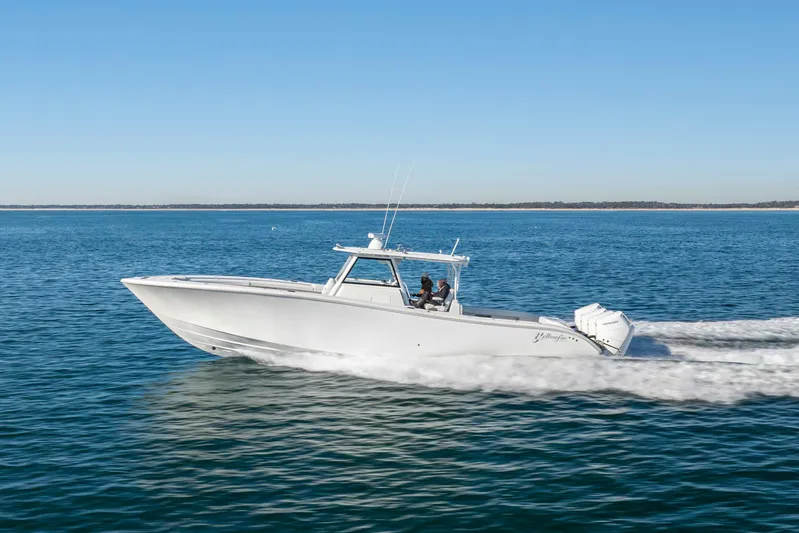  Yacht Photos Pics 2017 Yellowfin 42 Offshore boat cruising on open water.