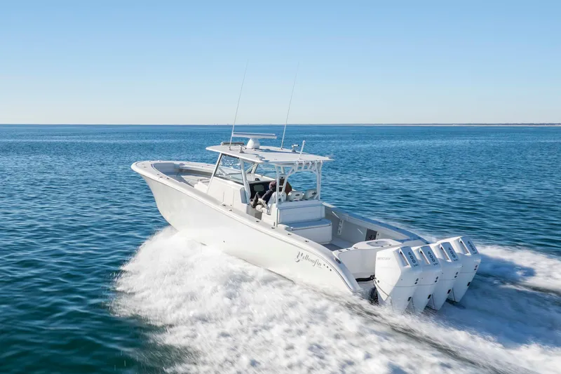  Yacht Photos Pics 2017 Yellowfin 42 Offshore boat cruising on open water, clear blue sky.