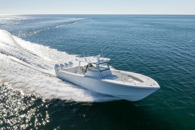  Yacht Photos Pics 2017 Yellowfin 42 Offshore boat cruising on open water, creating a dynamic wake.