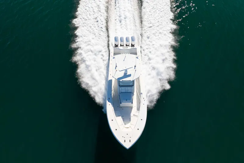  Yacht Photos Pics 2017 Yellowfin 42 Offshore boat cruising on open water, aerial view.