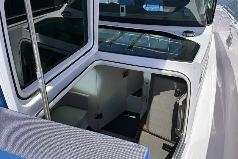  Yacht Photos Pics 2024 Axopar 37 XC CROSS CABIN interior view with open cabin door.