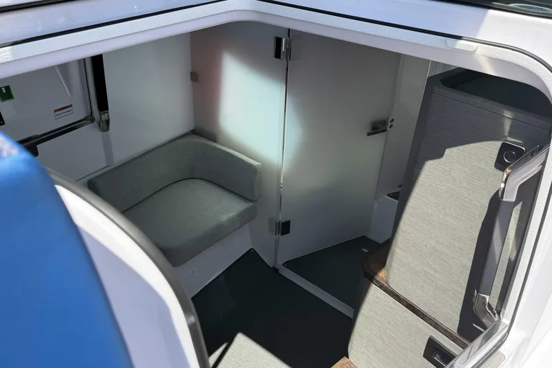  Yacht Photos Pics 2024 Axopar 37 XC CROSS CABIN interior with seating and modern design.