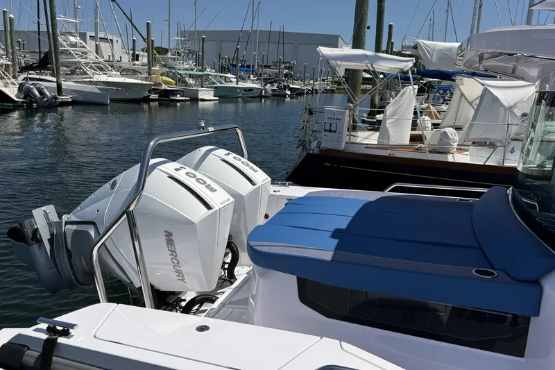  Yacht Photos Pics 2024 Axopar 37 XC CROSS CABIN with twin Mercury outboards docked at marina.