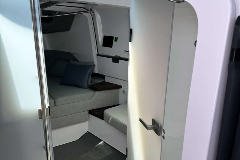 Yacht Photos Pics 2024 Axopar 37 XC CROSS CABIN interior with cozy seating and modern design.