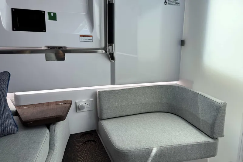  Yacht Photos Pics 2024 Axopar 37 XC CROSS CABIN interior with modern seating and sleek design.