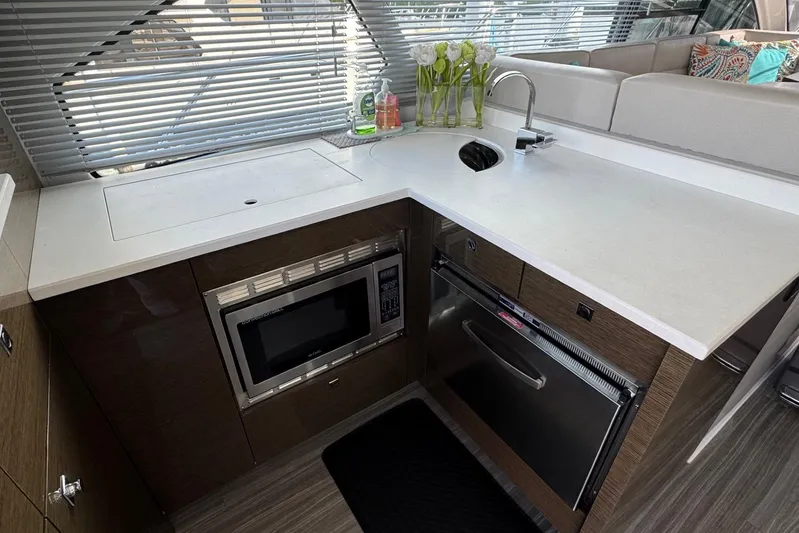  Yacht Photos Pics Modern kitchen area in 2019 Cruisers Yachts 50 Cantius with sleek appliances and stylish decor.