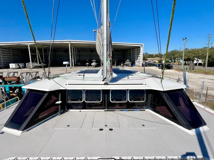 Windsurfer Yacht Photos Pics Custom Max Cruise 44SC 2022 catamaran docked at a marina under clear blue skies.