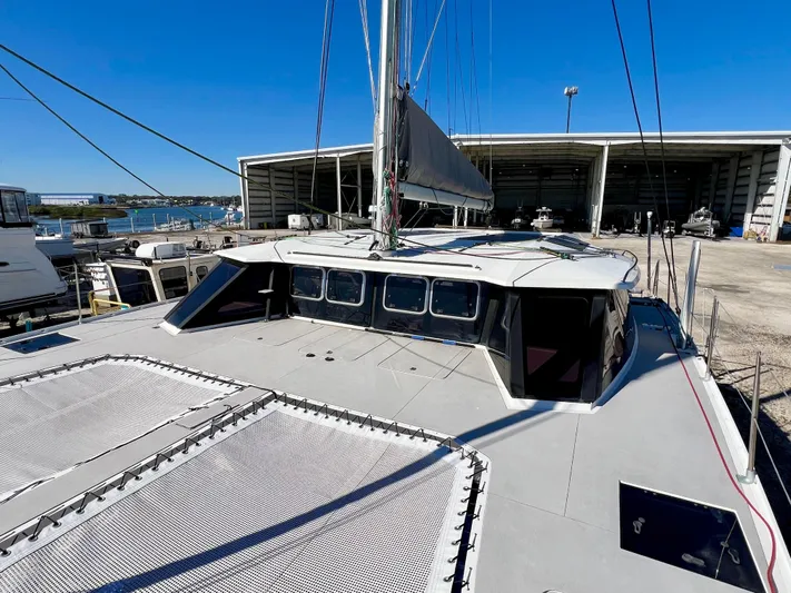 Windsurfer Yacht Photos Pics Custom Max Cruise 44SC catamaran, 2022 model, docked near a marina under clear blue skies.