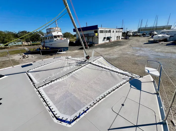 Windsurfer Yacht Photos Pics Custom Max Cruise 44SC 2022 catamaran on dry dock, showcasing deck and netting.