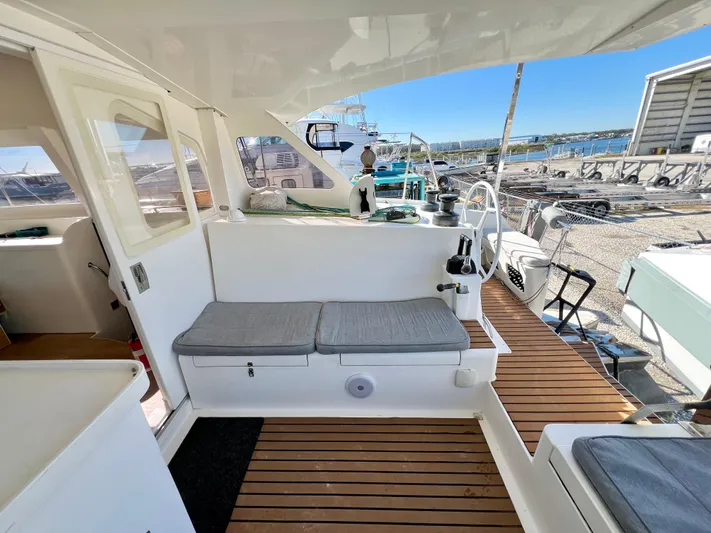 Windsurfer Yacht Photos Pics Custom Max Cruise 44SC 2022 yacht interior with cushioned seating and wooden flooring.