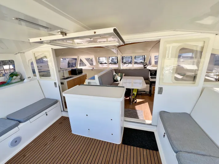 Windsurfer Yacht Photos Pics Spacious interior of 2022 Custom Max Cruise 44SC catamaran with modern seating and open layout.