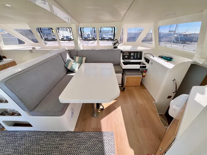Windsurfer Yacht Photos Pics Spacious interior of 2022 Custom Max Cruise 44SC catamaran with modern seating and navigation area.